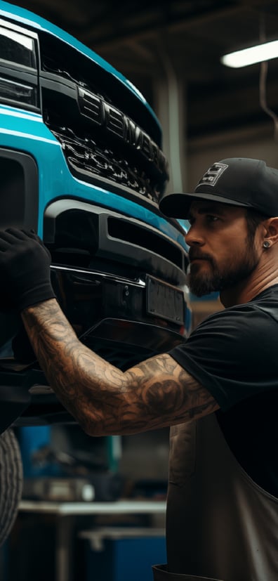 7_A-mechanic-under-a-car_235x490