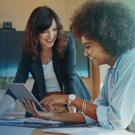 Happy-diverse-women-coaching-with-tablet_440x440